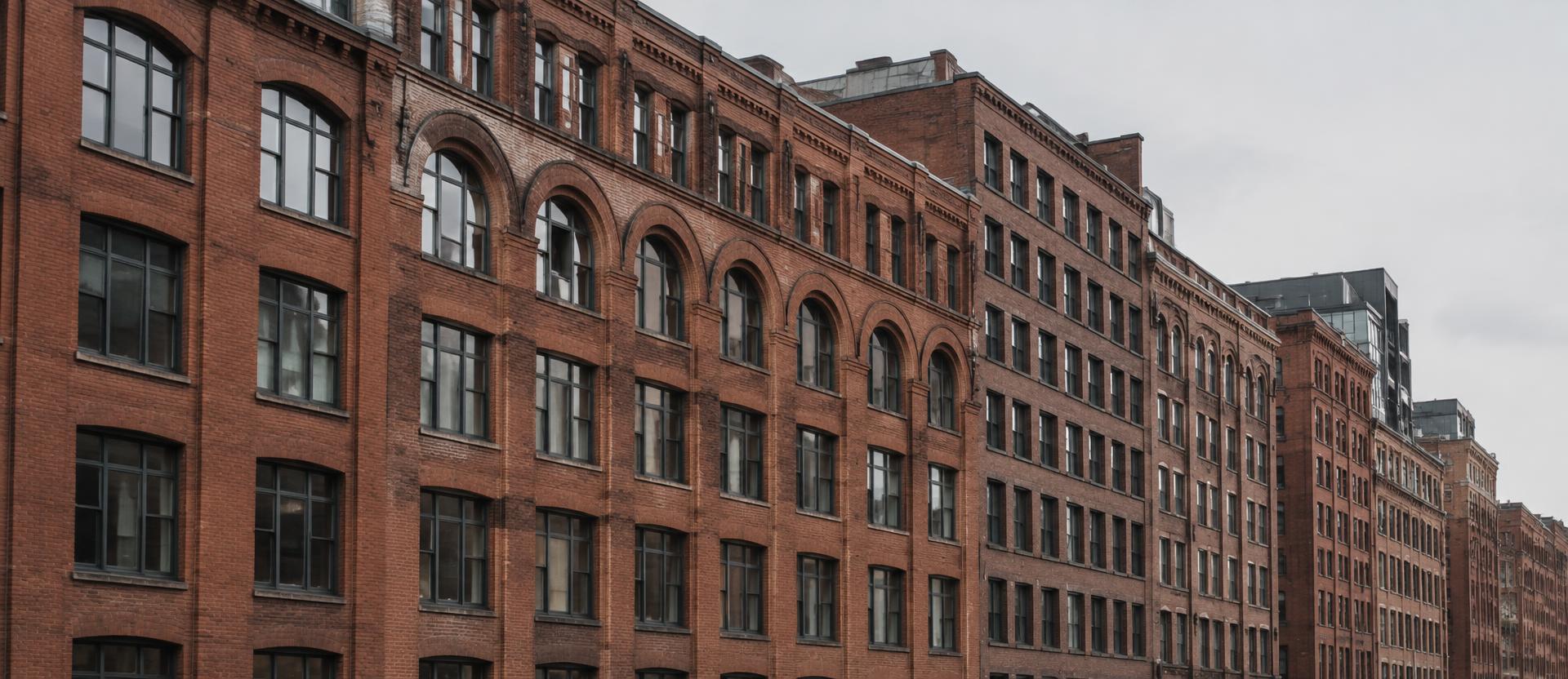 Long run of brick commercial warehouse facades in Boston's Fort Point district